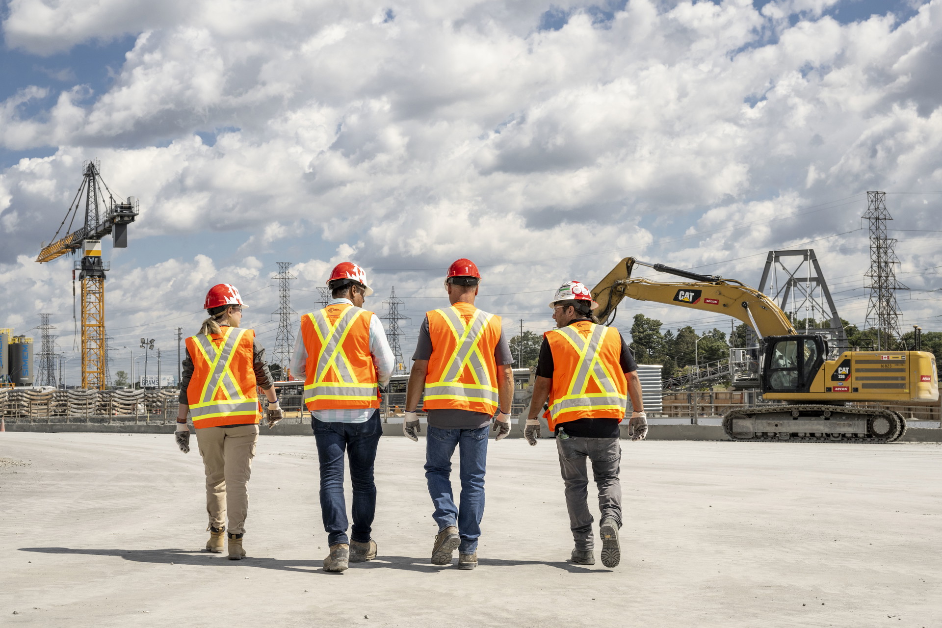 Aecon staff wearing safety gear and PPE on a site