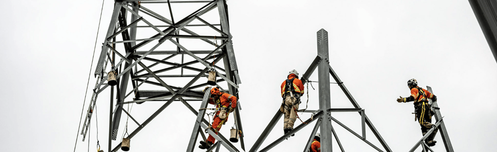AMP7G team members working up pylon