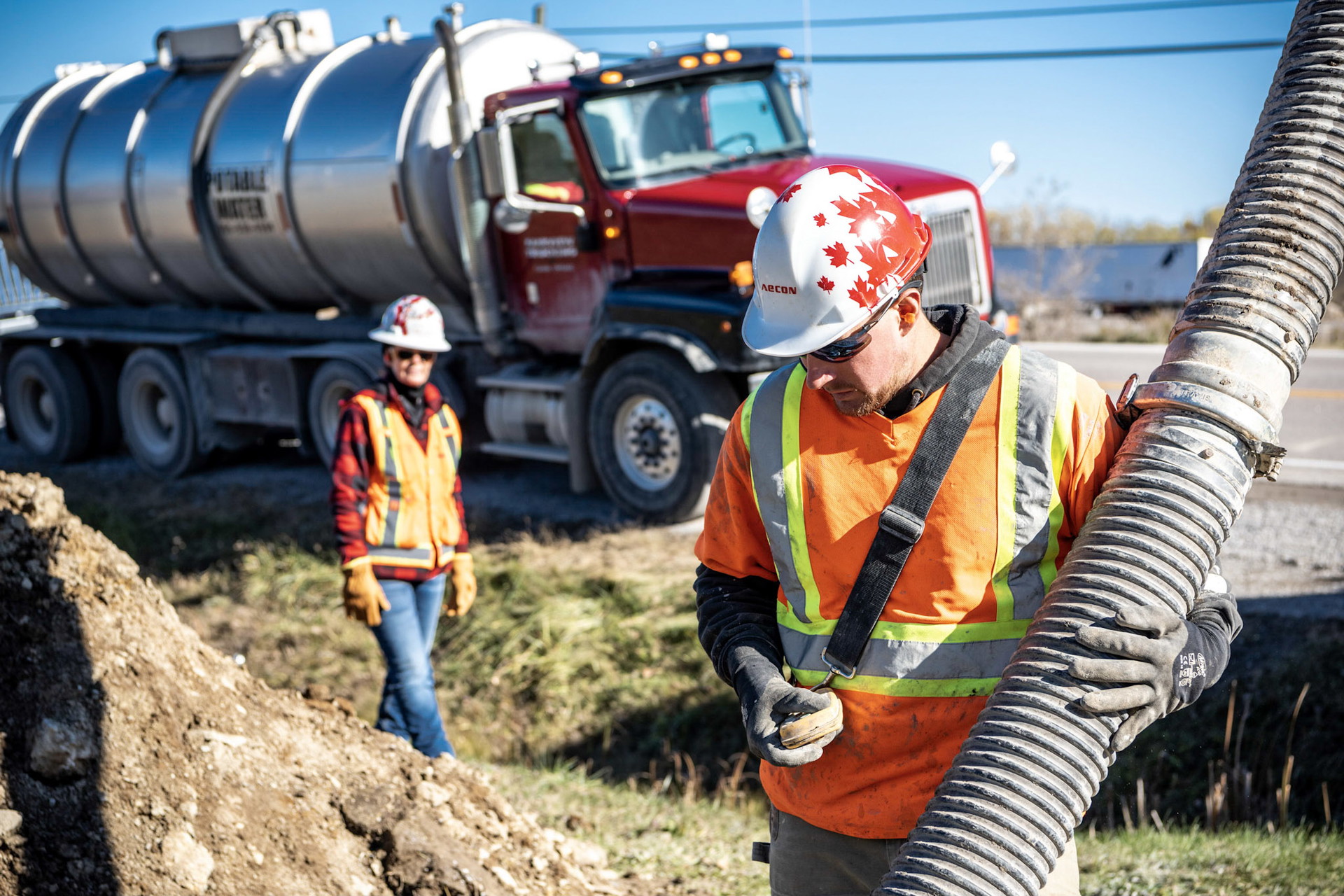 Two Aecon staff working on site